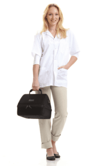 Clinician carrying the BeamMed Sunlight MiniOmni bone density ultrasonometer in its black carry case